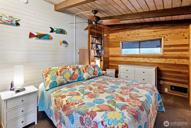 a bedroom with a bed and a dresser