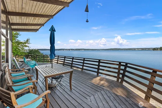 a view of terrace with wooden floor and outdoor seating