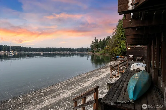 a view of a lake with a house in the background