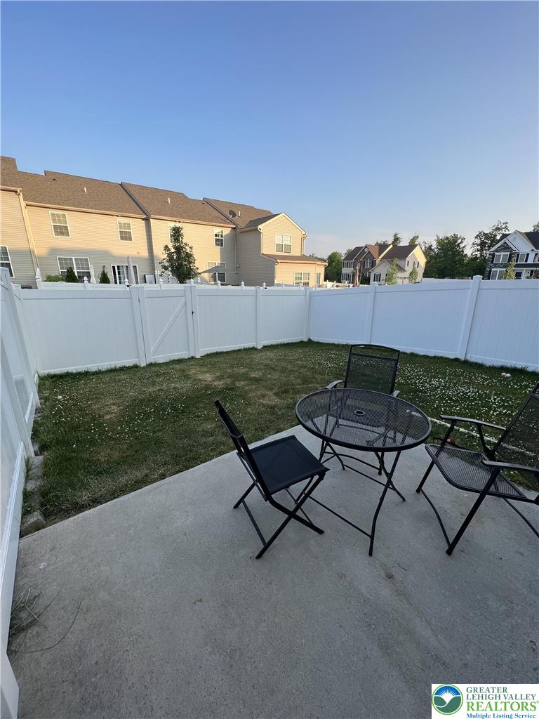 5380 Jutland Road Allentown, PA 18104 - Photo 26 of 27 A private, enclosed yard with a compact patio space for outdoor relaxation.
