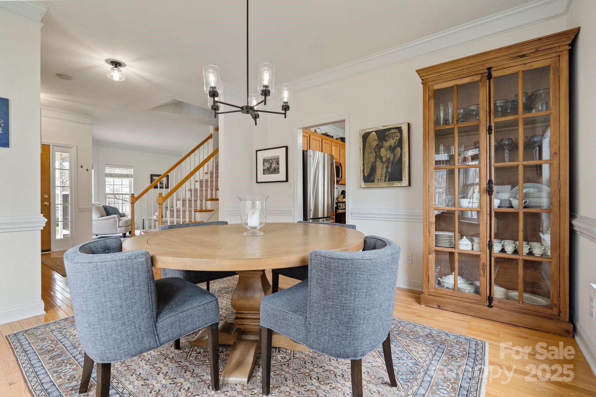 19302 Ruffner Drive Cornelius, NC 28031 - Photo 11 of 44 a view of a a dining room with furniture window and wooden floor