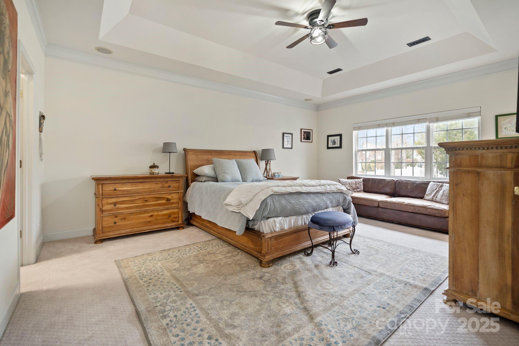 19302 Ruffner Drive Cornelius, NC 28031 - Photo 25 of 44 a bedroom with a bed and a couch