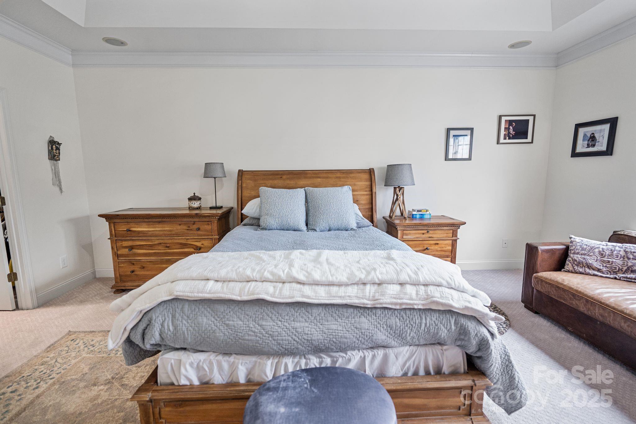 19302 Ruffner Drive Cornelius, NC 28031 - Photo 26 of 44 a bedroom with a bed and couch