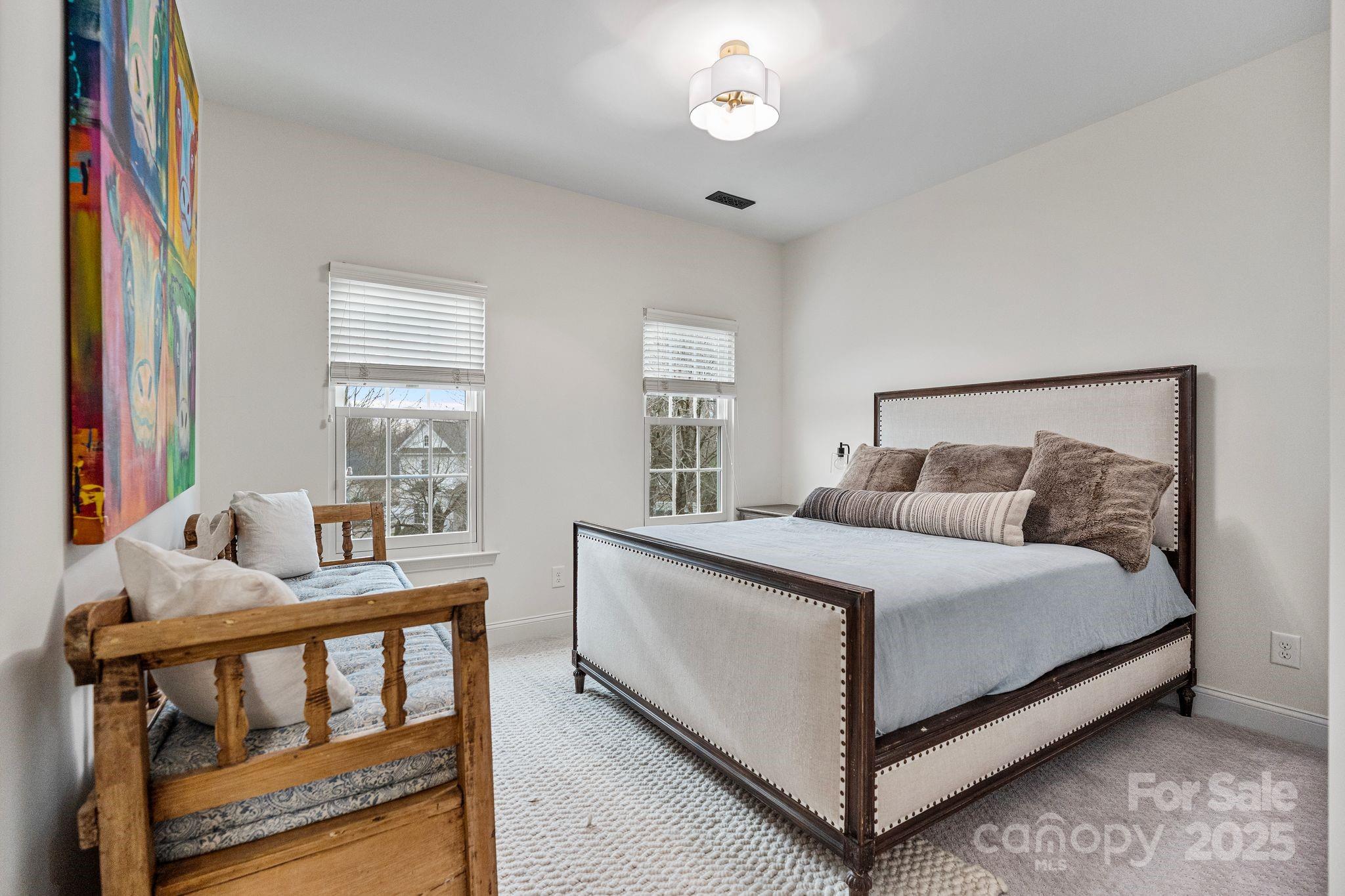 19302 Ruffner Drive Cornelius, NC 28031 - Photo 33 of 44 a bedroom with a bed and a window