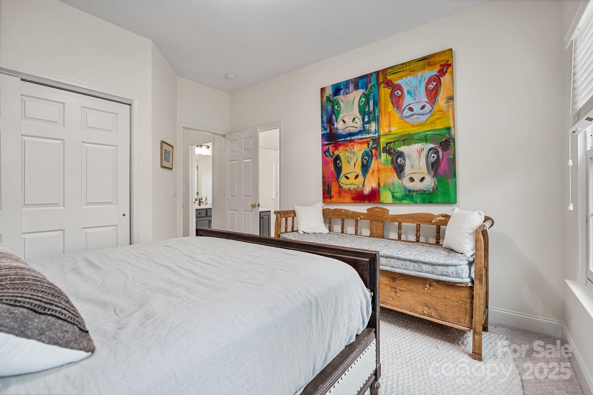 19302 Ruffner Drive Cornelius, NC 28031 - Photo 34 of 44 a bedroom with a bed and painting on the wall