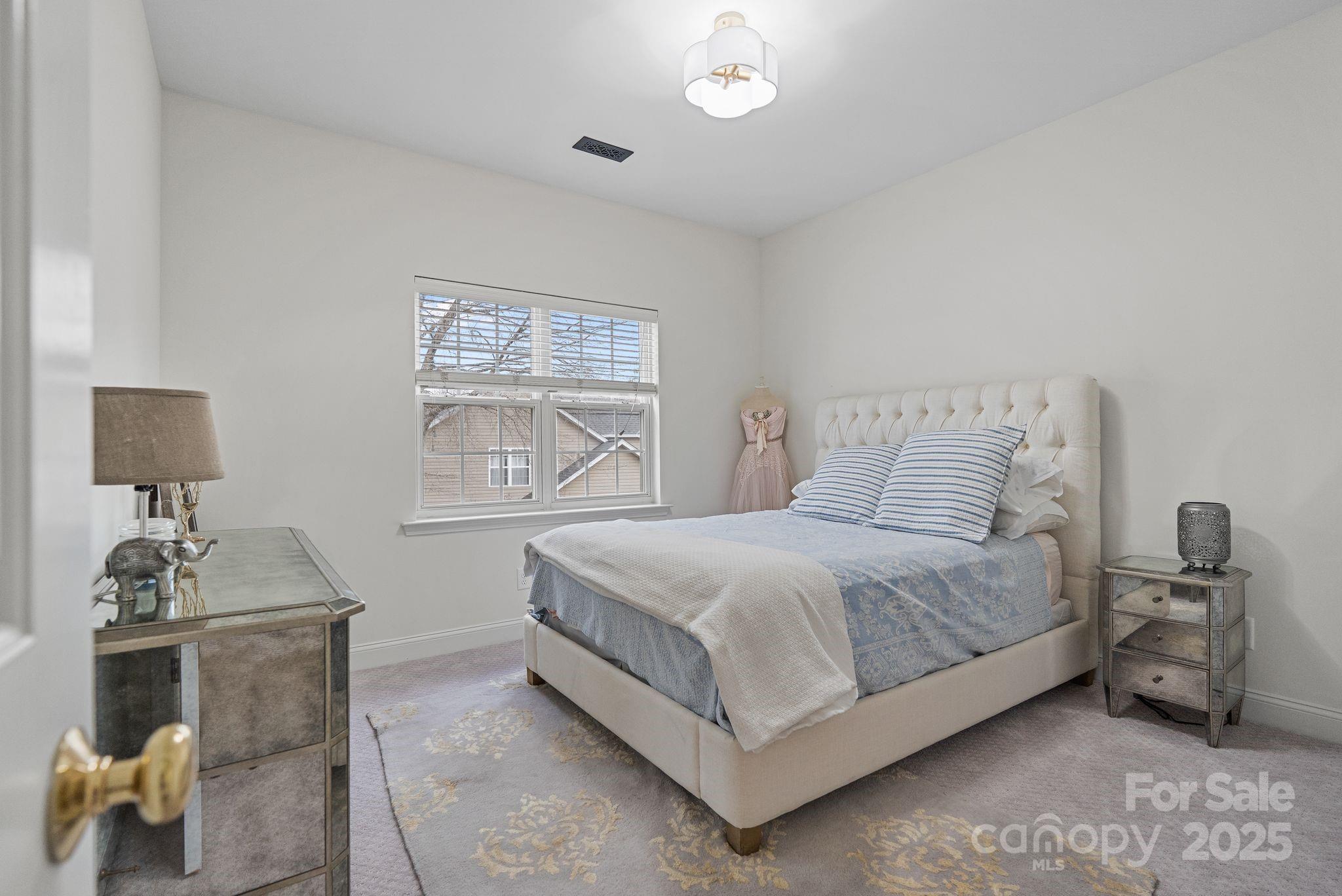 19302 Ruffner Drive Cornelius, NC 28031 - Photo 37 of 44 a bedroom with a bed and a window