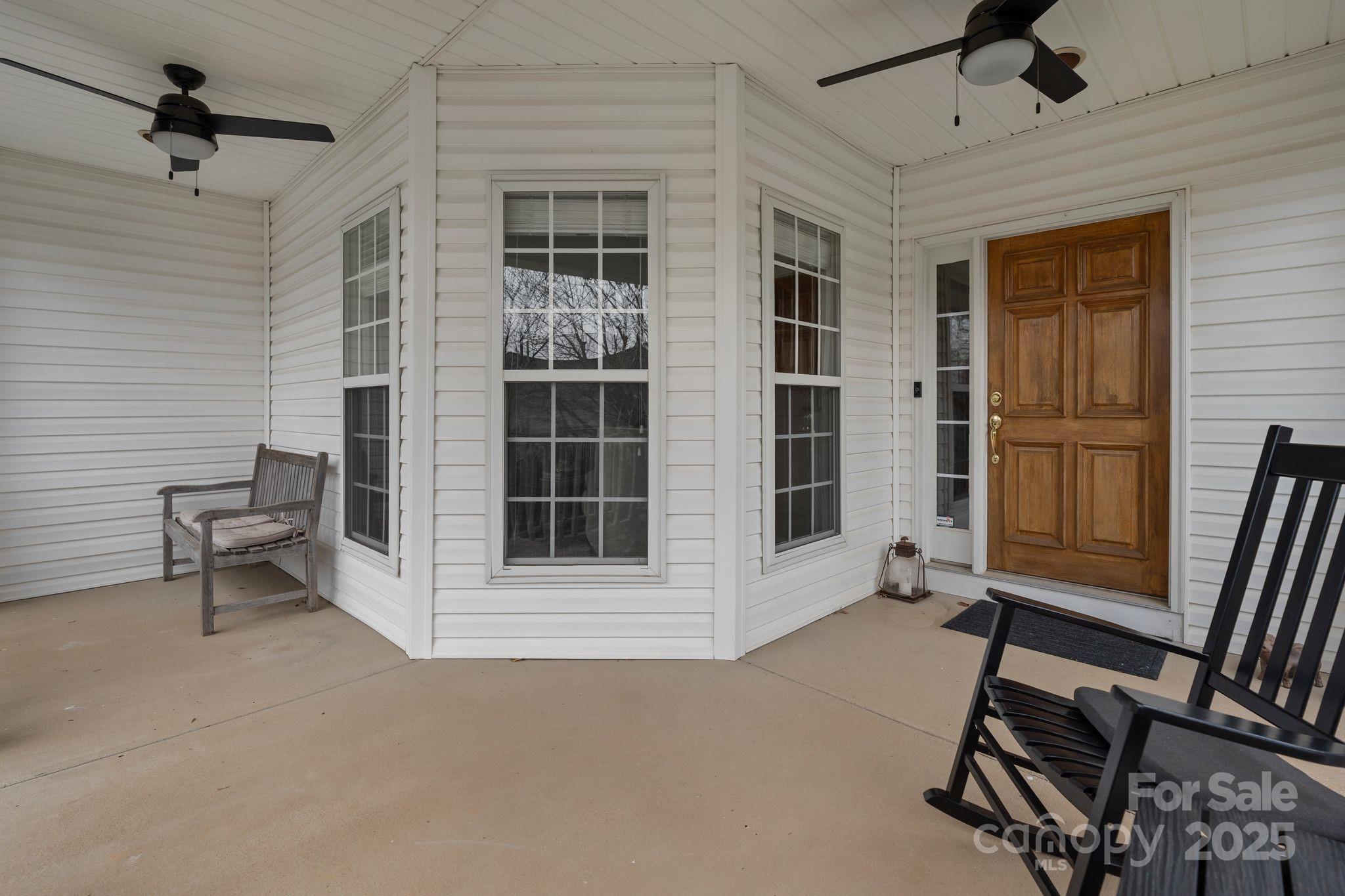 19302 Ruffner Drive Cornelius, NC 28031 - Photo 4 of 44 a view of an empty room with a window and wooden floor