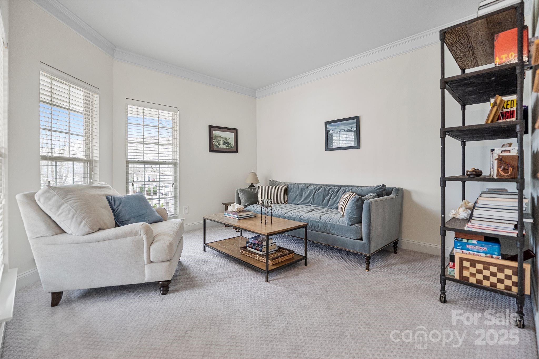 19302 Ruffner Drive Cornelius, NC 28031 - Photo 7 of 44 a living room with furniture a rug and a window