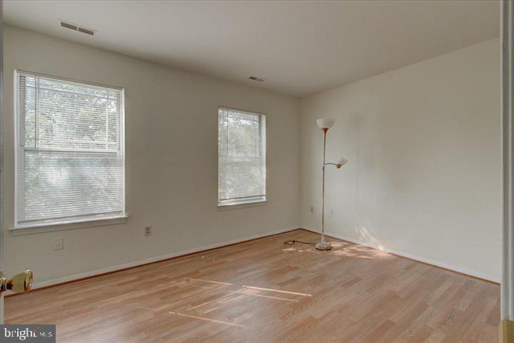 1543 Holbrook Street Baltimore, MD 21202 - Photo 4 of 23 an empty room with windows