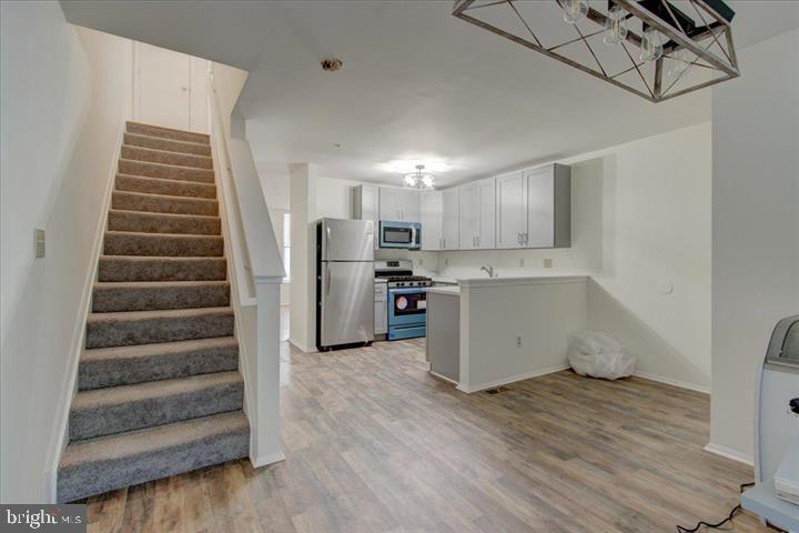 1543 Holbrook Street Baltimore, MD 21202 - Photo 9 of 23 a view of kitchen with furniture and wooden floor