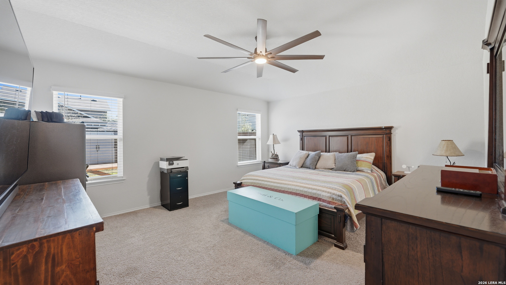 3649 Copper Bulverde, TX 78163 - Photo 20 of 45 a bedroom with a bed and a chandelier