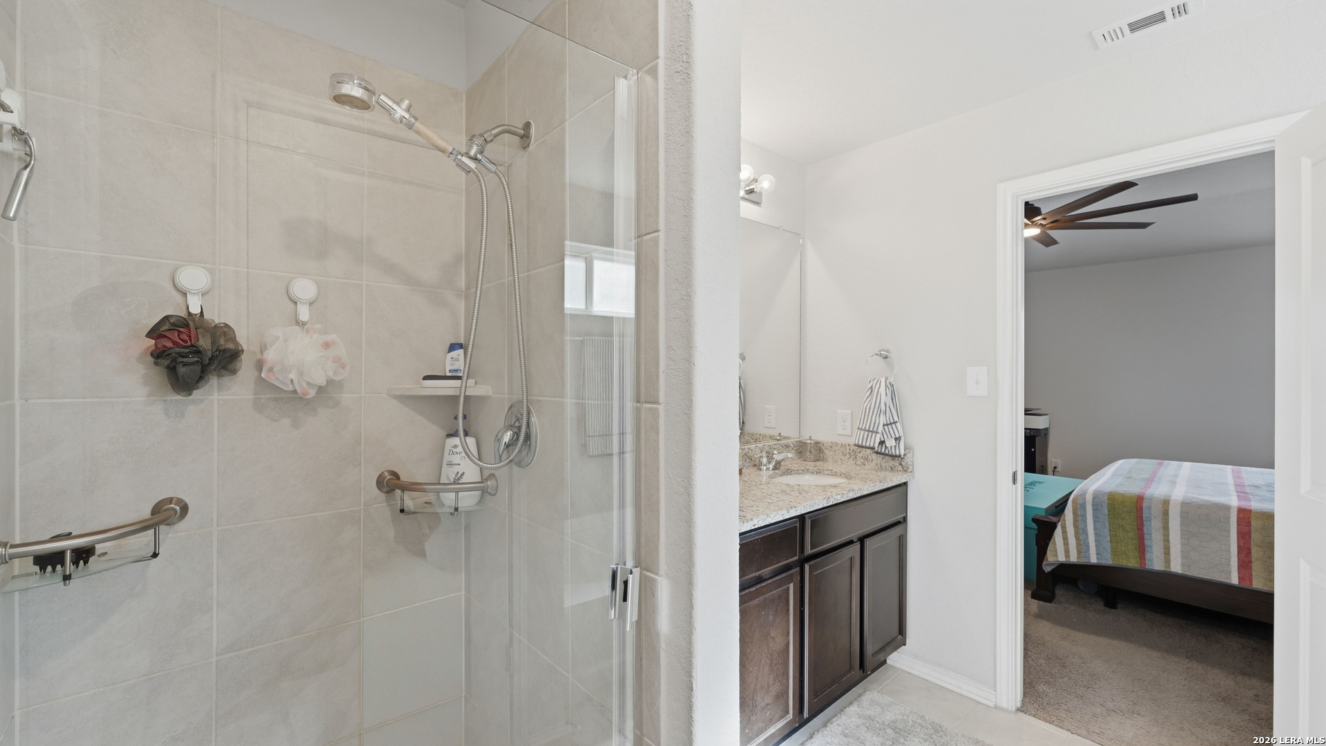 3649 Copper Bulverde, TX 78163 - Photo 22 of 45 a en suite bathroom with a sink a mirror and a shower