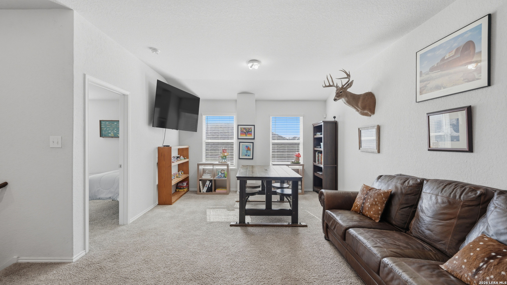 3649 Copper Bulverde, TX 78163 - Photo 26 of 45 a living room with furniture and a flat screen tv
