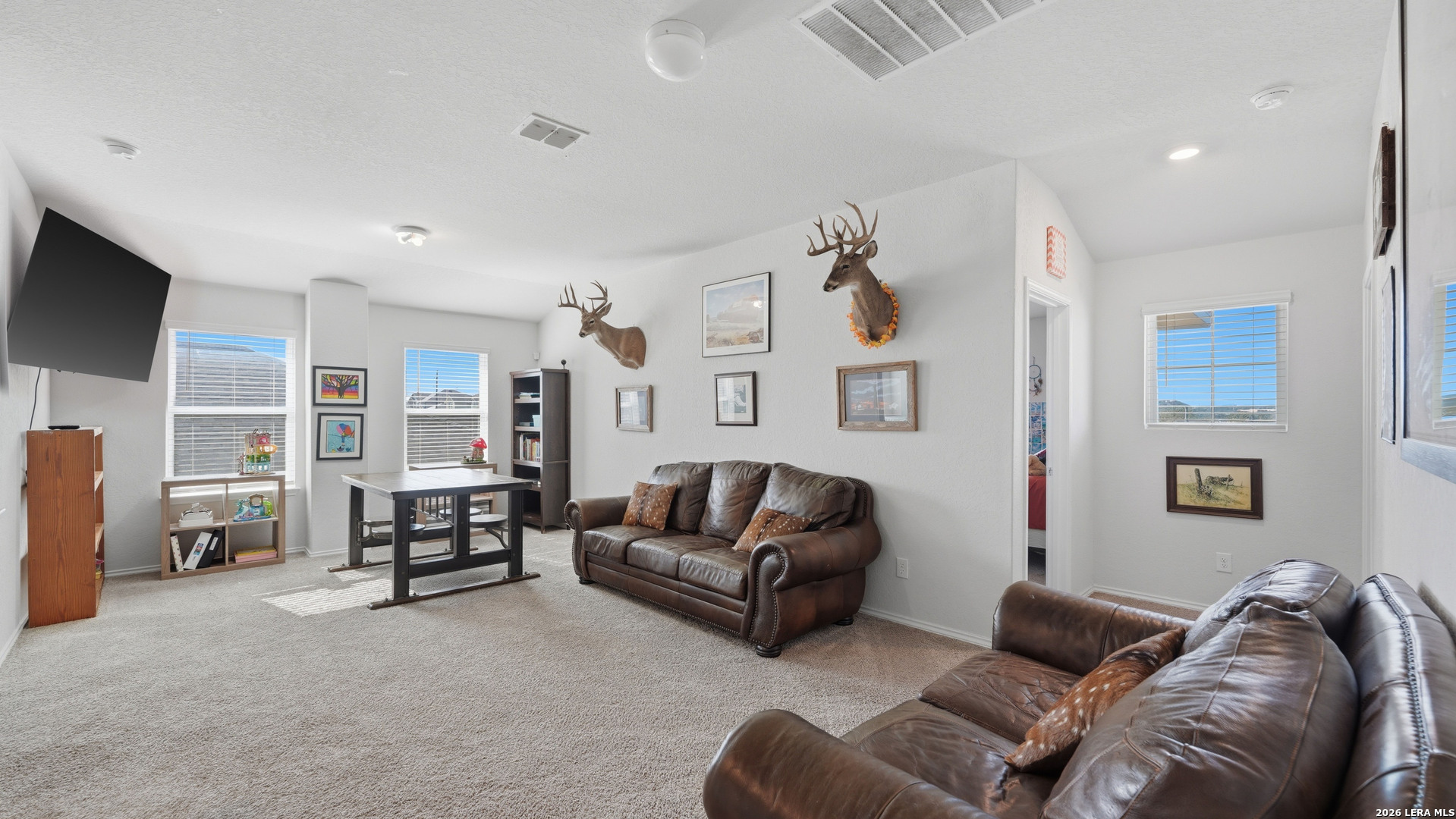 3649 Copper Bulverde, TX 78163 - Photo 28 of 45 a living room with furniture and a flat screen tv