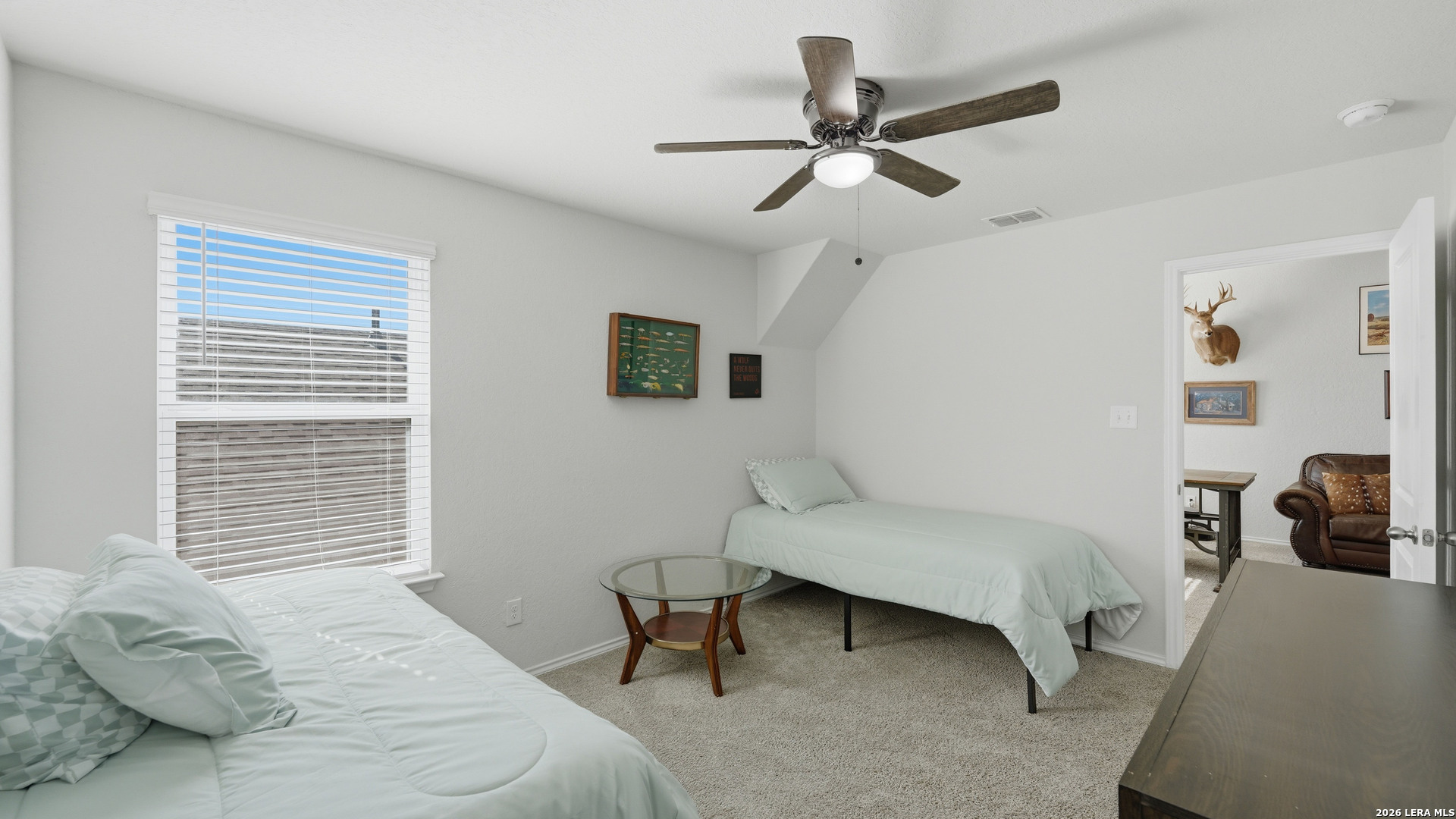 3649 Copper Bulverde, TX 78163 - Photo 34 of 45 a bedroom with a bed a couch and a ceiling fan