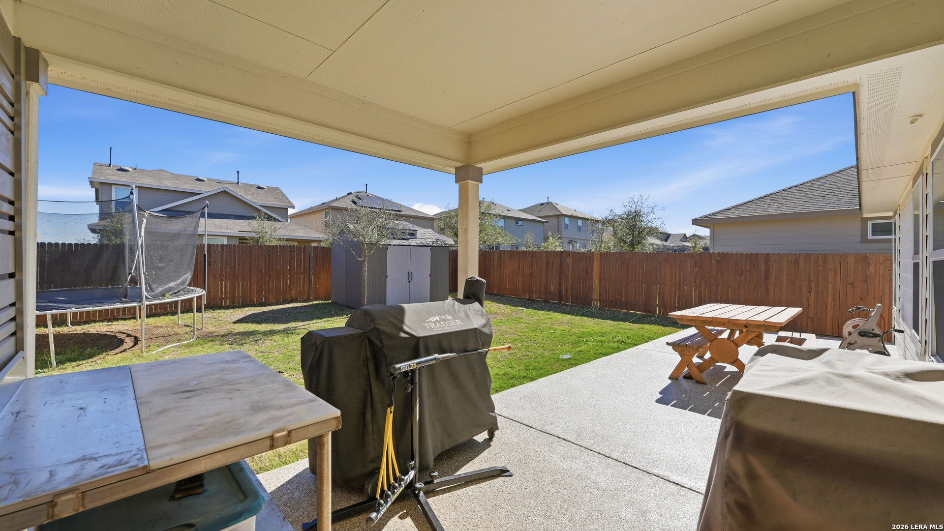 3649 Copper Bulverde, TX 78163 - Photo 4 of 45 a view of a patio with a table chairs and a backyard