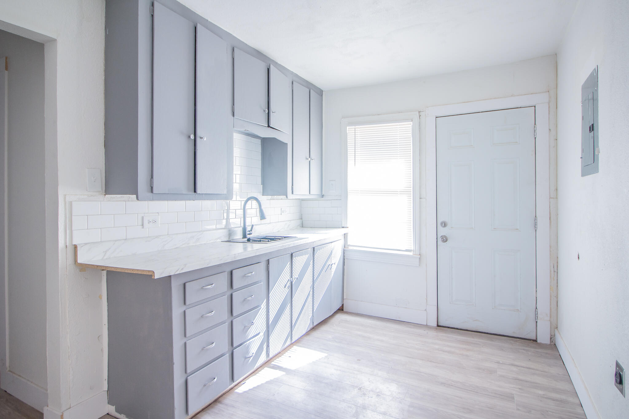 302 Avenue U Lubbock, TX 79415 - Photo 11 of 26 a bathroom with a granite countertop sink and a mirror