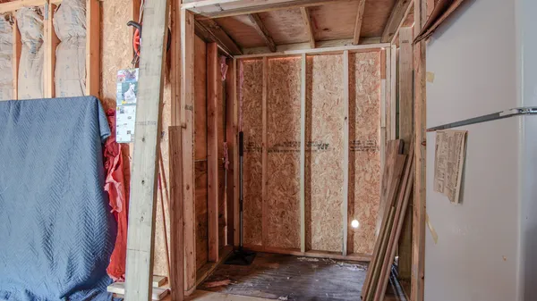 a view of walk in closet with clothes