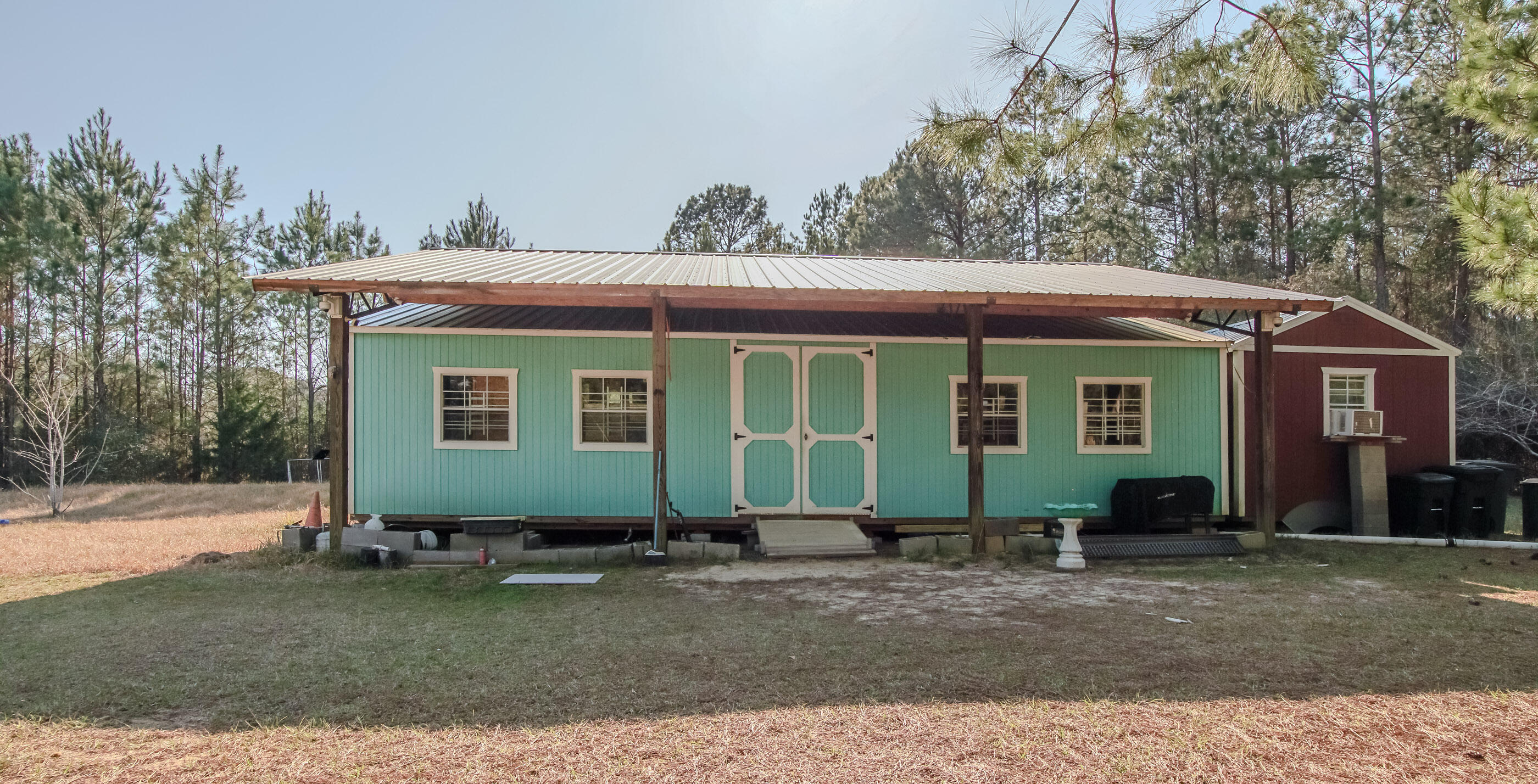 2444 Hardy Skipper Road Ponce de Leon, FL 32455 - Photo 2 of 21 a front view of a house with garden