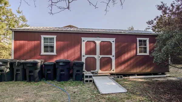 a view of a back yard of the house