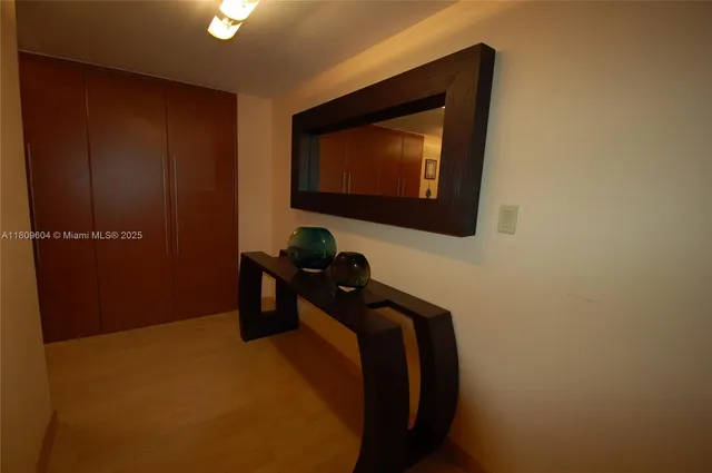 a living room with furniture and large windows