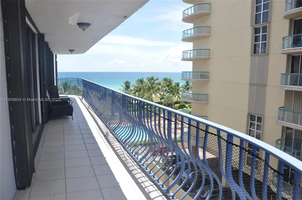 a view of a balcony with residential area