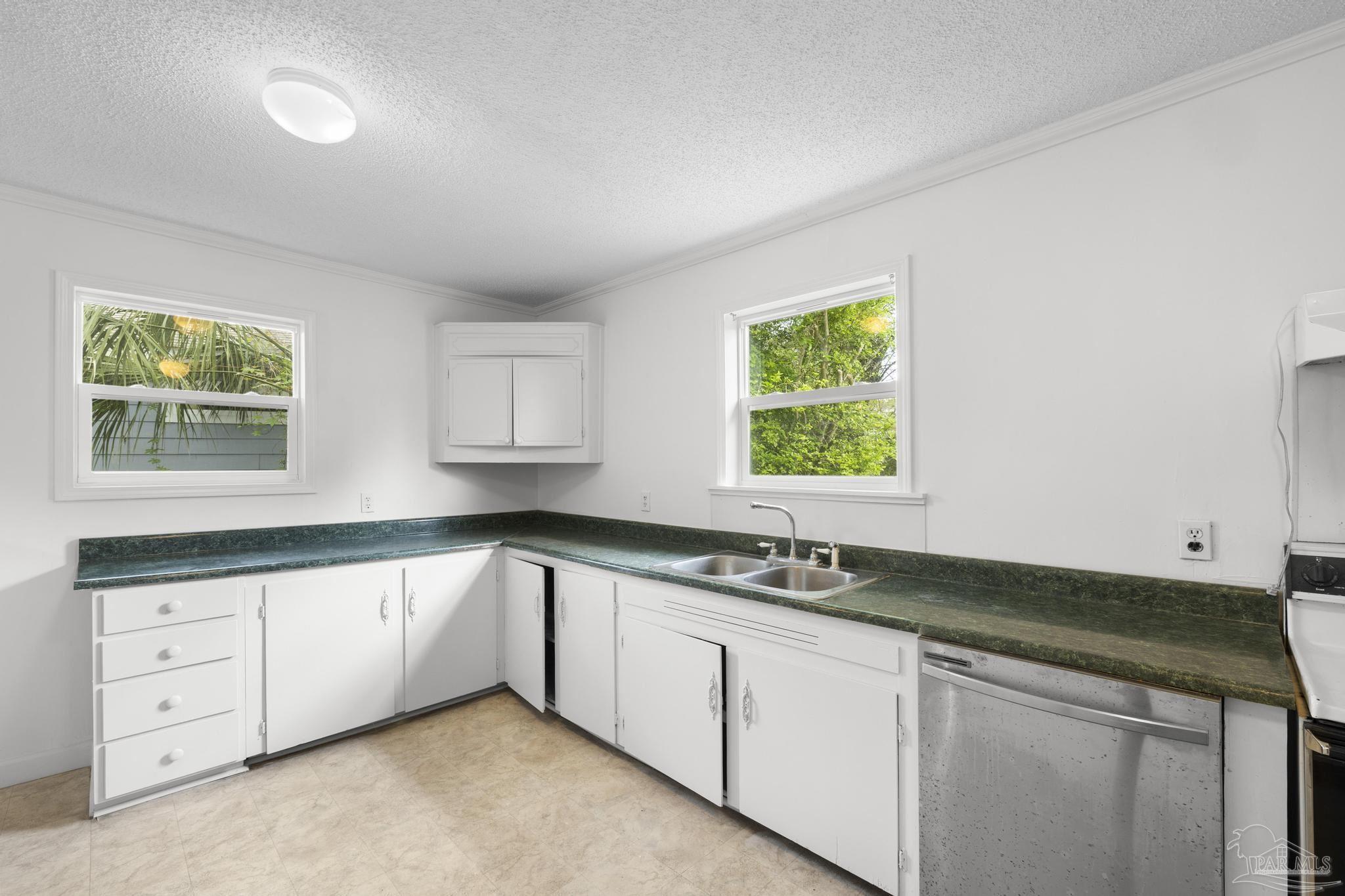 208 Berry Road Pensacola, FL 32507 - Photo 19 of 41 a kitchen with granite countertop a sink and a window