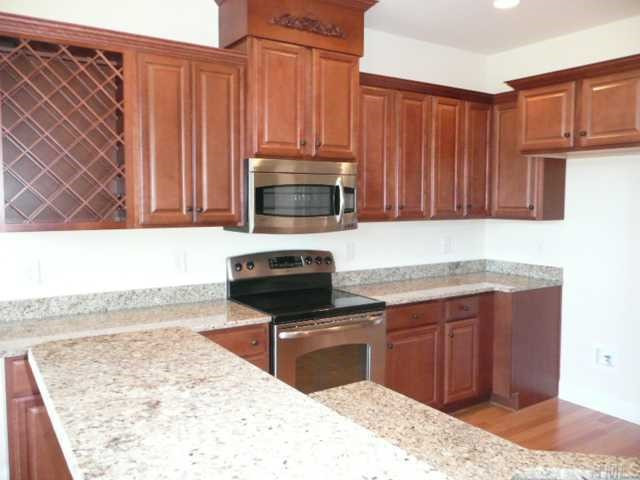 2207 Moores Mill Road Rougemont, NC 27572 - Photo 6 of 12 Granite Countertops, Built in Wine Rack, 42" Marsh Cabinetry, Stainless Steel Appliances, Breakfast Bar Area, Smooth Top Range, Microwave, Dishwasher - All Light and Bright - "A Cook's Delight" Kitchen