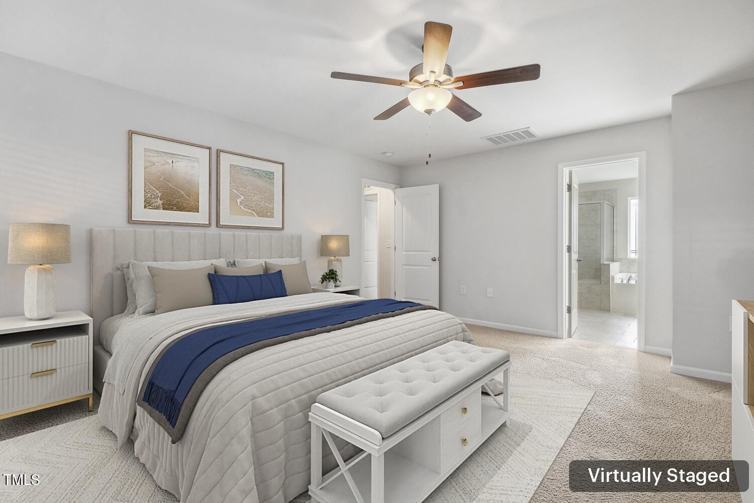 232 Big Barn Drive Wendell, NC 27591 - Photo 34 of 56 a bedroom with a large bed and a chandelier