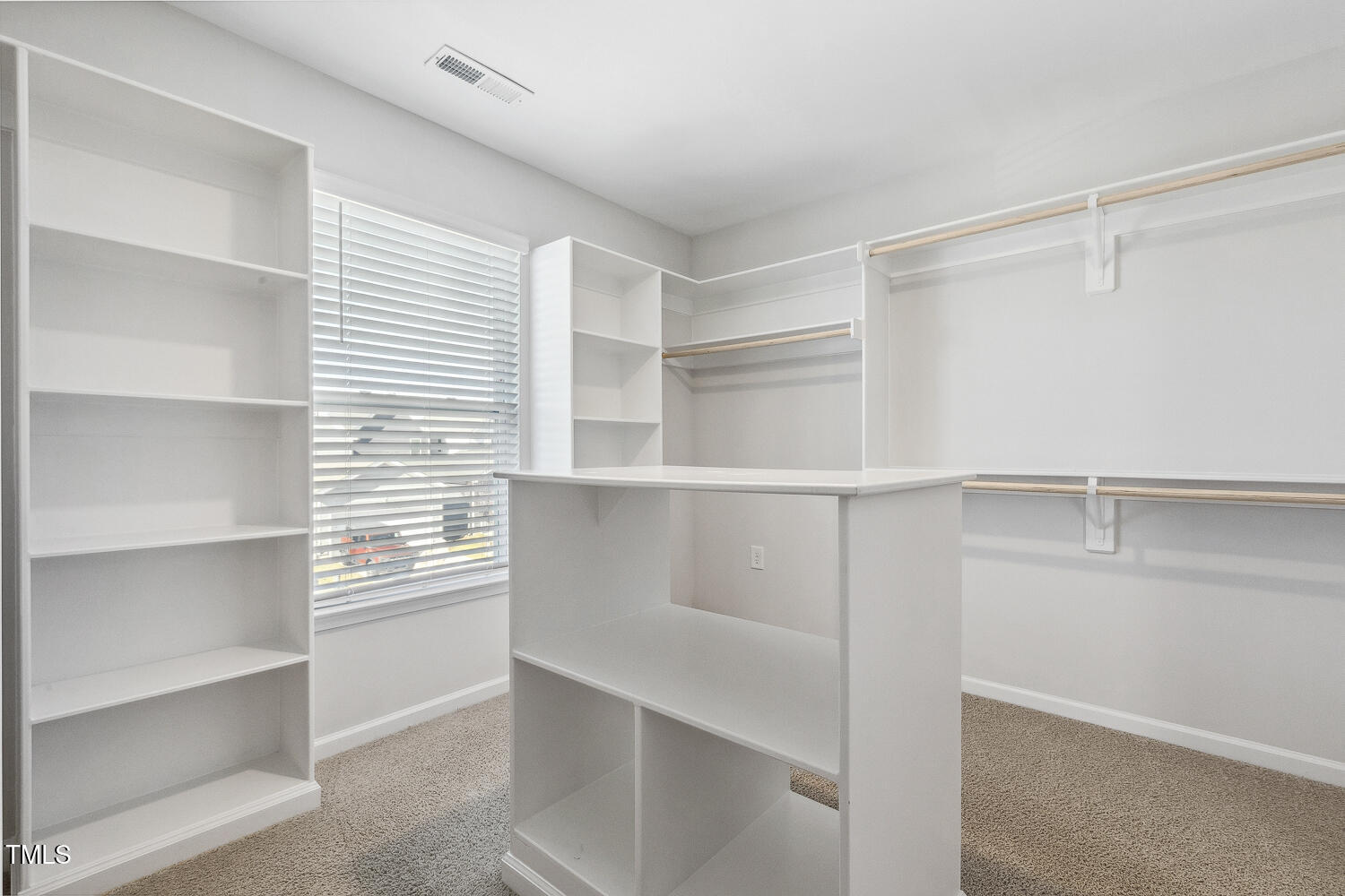 232 Big Barn Drive Wendell, NC 27591 - Photo 38 of 56 a view of walk in closet with empty racks