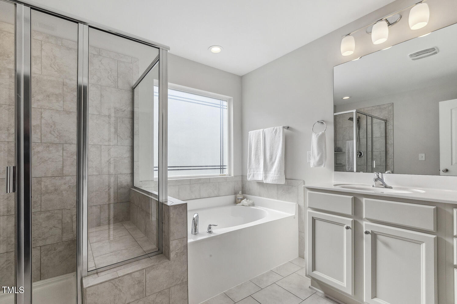 232 Big Barn Drive Wendell, NC 27591 - Photo 41 of 56 a bathroom with a double vanity sink mirror and shower