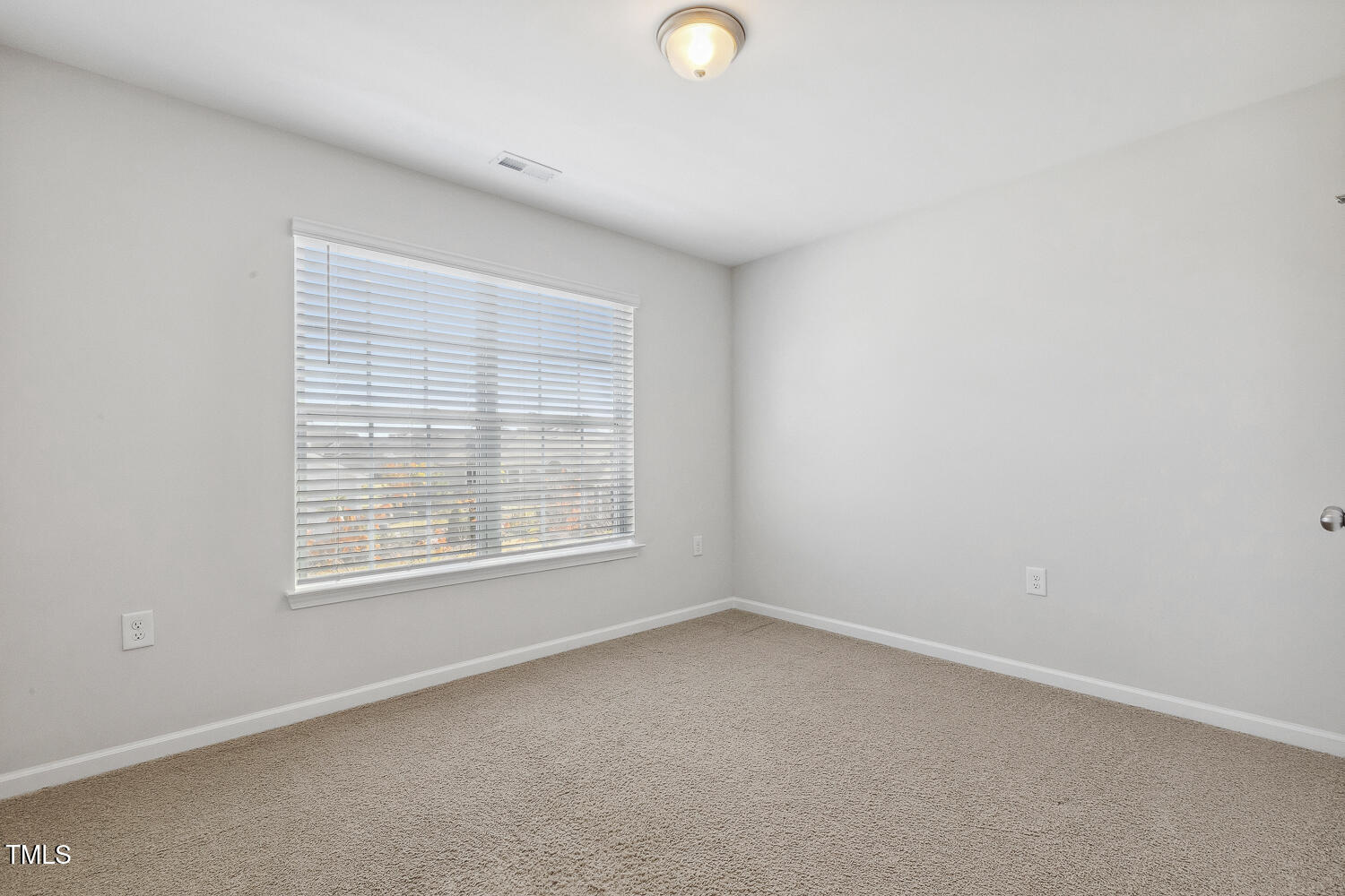 232 Big Barn Drive Wendell, NC 27591 - Photo 43 of 56 an empty room with a window
