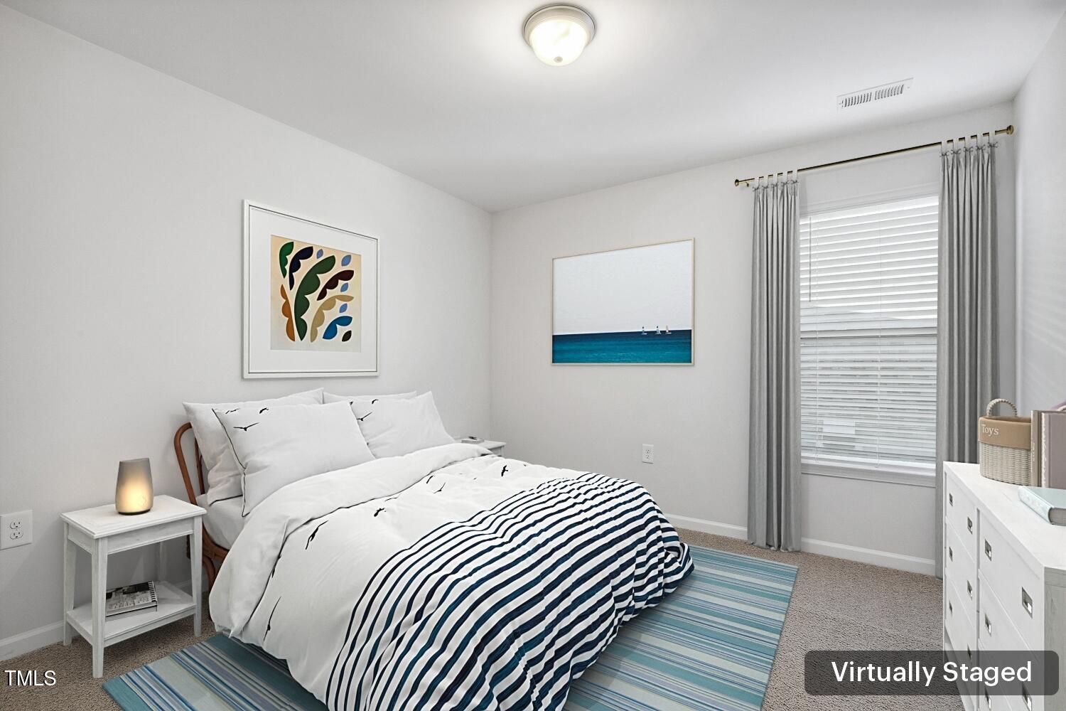 232 Big Barn Drive Wendell, NC 27591 - Photo 47 of 56 a bedroom with a bed and painting on the wall