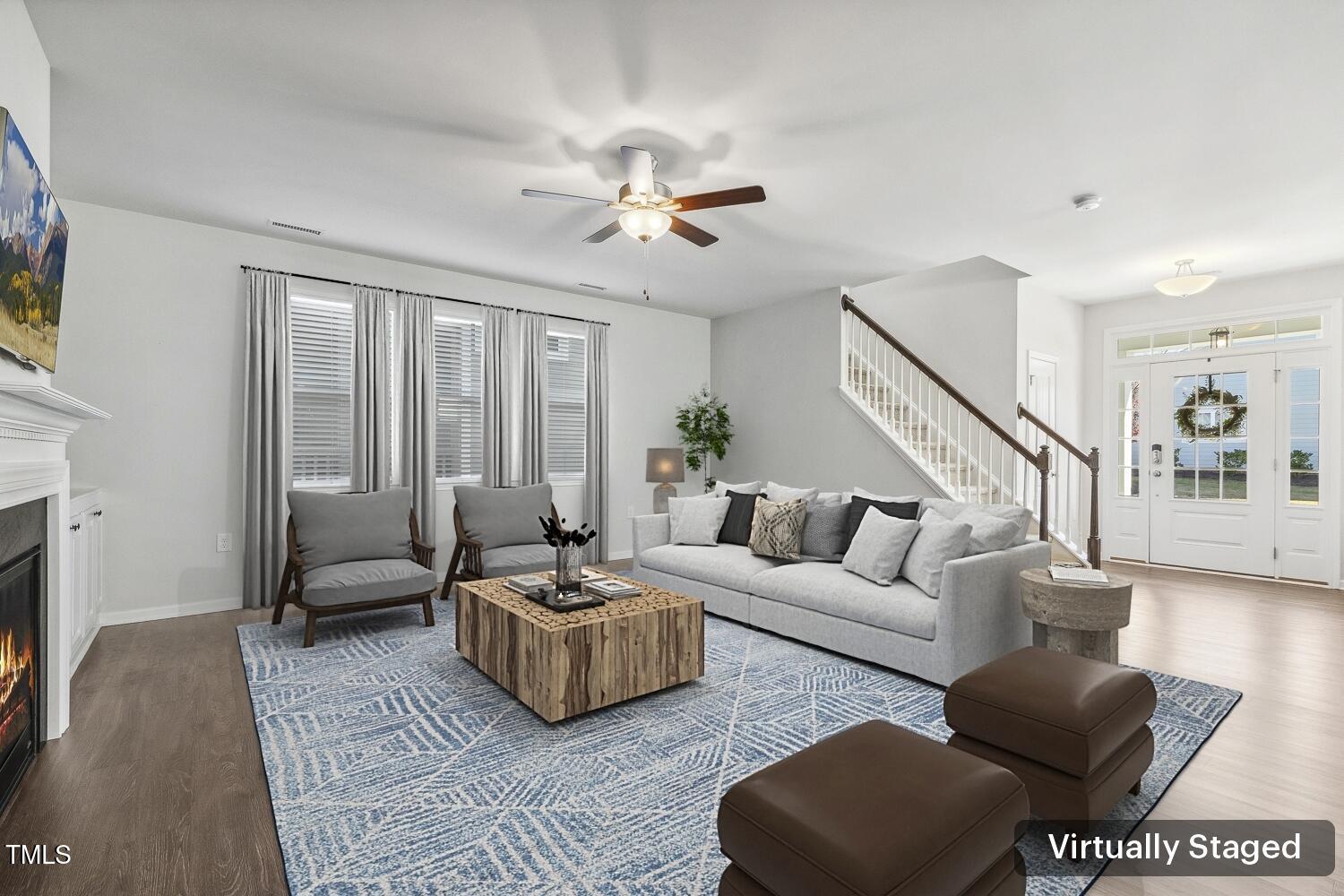 232 Big Barn Drive Wendell, NC 27591 - Photo 10 of 56 a living room with furniture ceiling fan and a rug