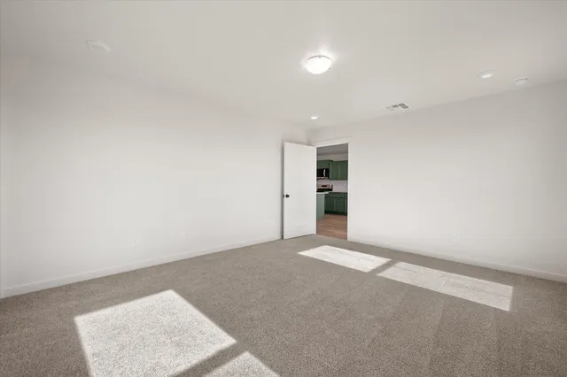 an empty room with an entrance and door