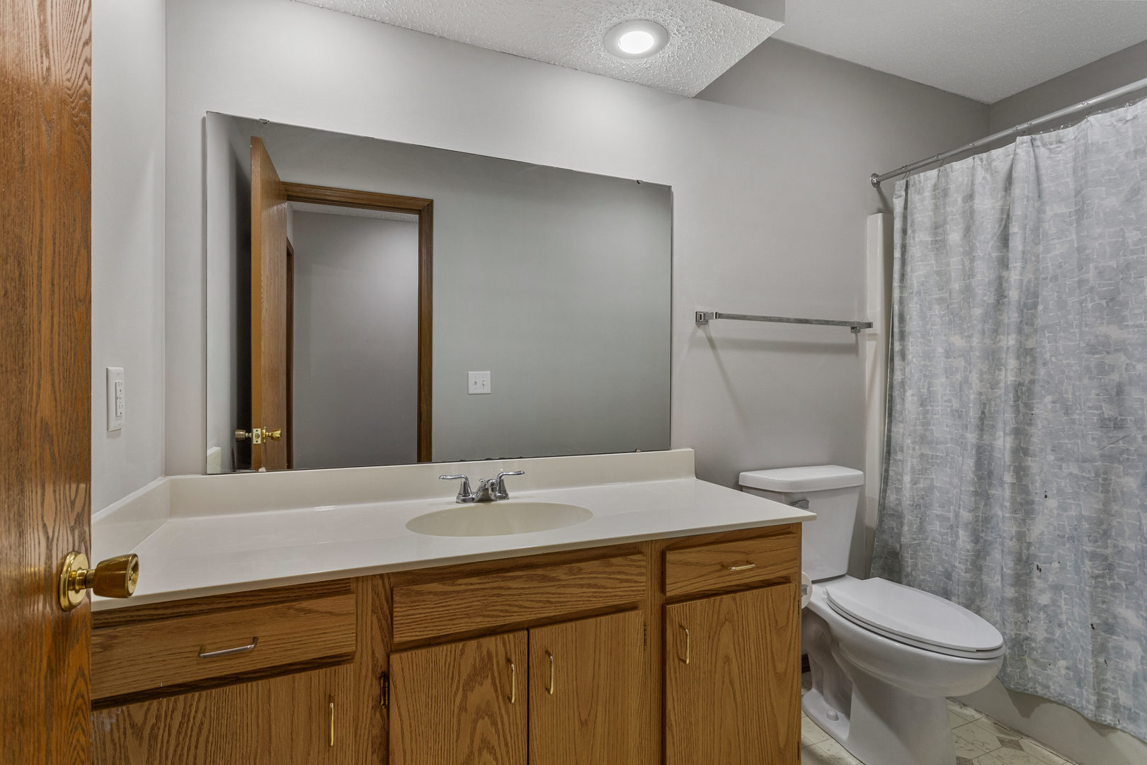 413 Irvine Road, Unit 413 Champaign, IL 61822 - Photo 16 of 29 a bathroom with a sink toilet and shower