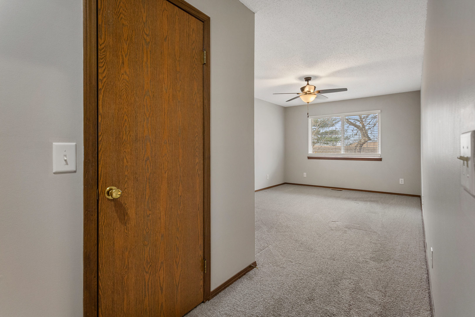 413 Irvine Road, Unit 413 Champaign, IL 61822 - Photo 21 of 29 an empty room with windows and closet