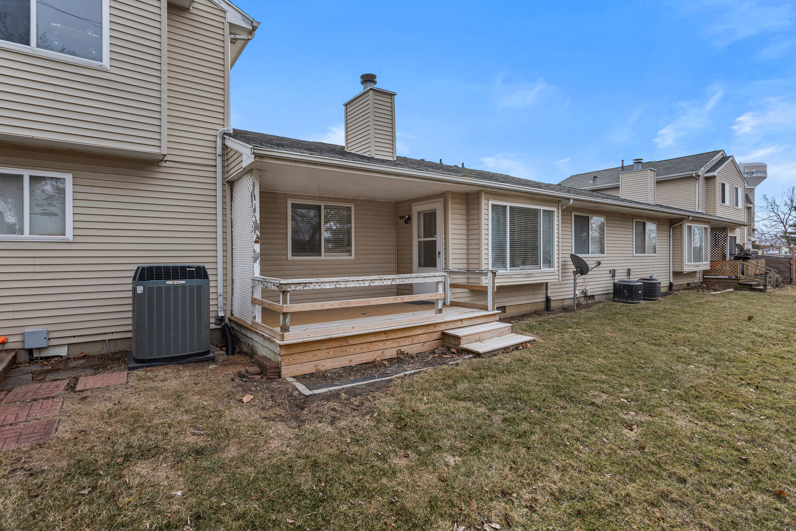 413 Irvine Road, Unit 413 Champaign, IL 61822 - Photo 26 of 29 a front view of a house with a yard