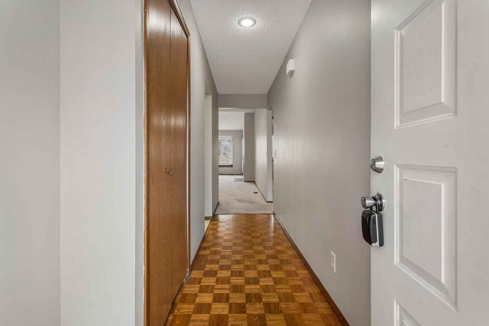 413 Irvine Road, Unit 413 Champaign, IL 61822 - Photo 4 of 29 a view of hallway with wooden floor