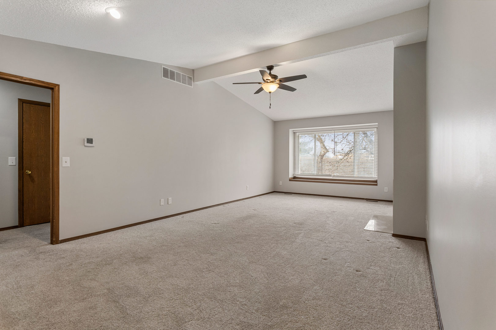 413 Irvine Road, Unit 413 Champaign, IL 61822 - Photo 5 of 29 a view of empty room with windows
