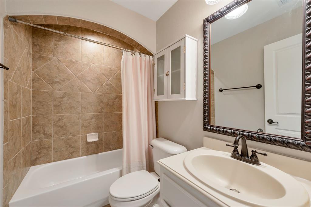 701 Buffalo Springs Drive Prosper, TX 75078 - Photo 14 of 15 a bathroom with a sink toilet and shower