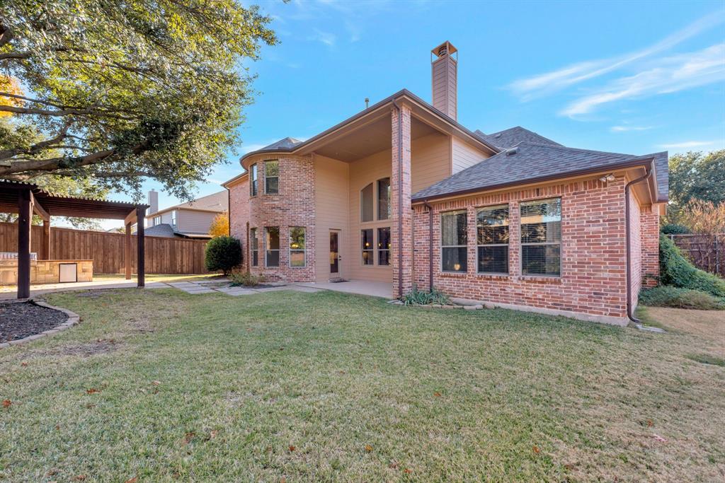701 Buffalo Springs Drive Prosper, TX 75078 - Photo 15 of 15 a view of a yard in front of a house with large trees
