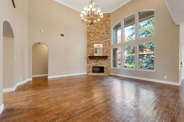 a view of livingroom with window fireplace and hardwood floor