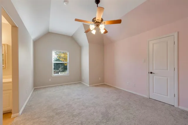 a view of a livingroom with a ceiling fan and window