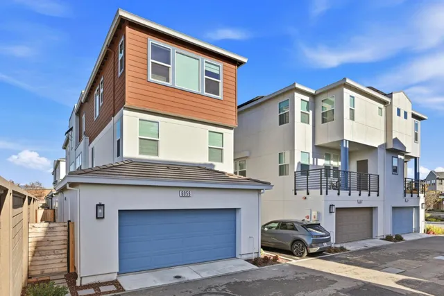 a living room with furniture and windows