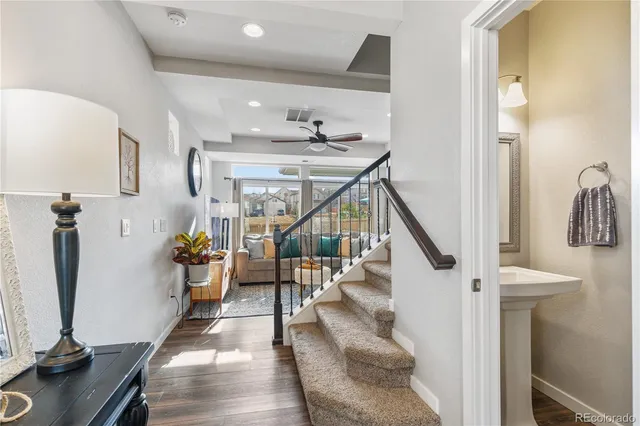a view of entryway and hall with wooden floor