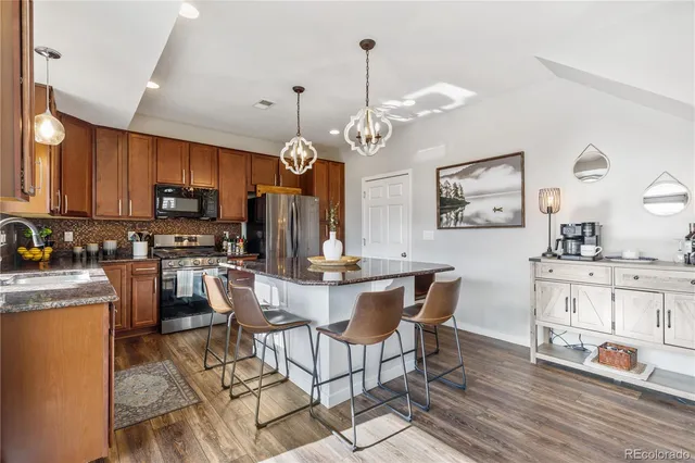 a view of a dining room kitchen and a wooden floor