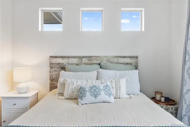 a bedroom with a bed and closet