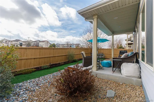 a view of a chair and table in the patio