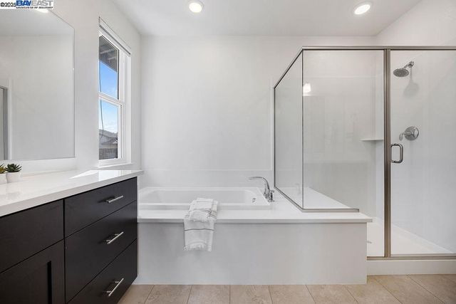 a bathroom with a bathtub and a sink